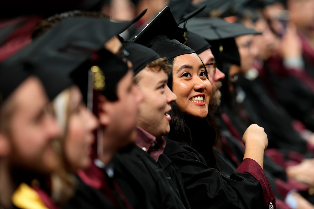 Texas A&amp;M student smiles during graduation ceremony